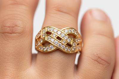 Macro close-up shot of a human model wearing a premium 22K gold toe ring embellished with brilliant diamonds, featuring a trending stylish designer pattern and sharp radiant jewelry reflections. Ultra-clear focus on the toe ring with natural clean skin texture, shown against a soft bright minimal background. Perfectly centered refined composition, hyper-realistic luxury lighting, ultra-trending and uniquely attractive jewelry aesthetic, crisp fine detailing with elegant highlights, high-attraction iconic je